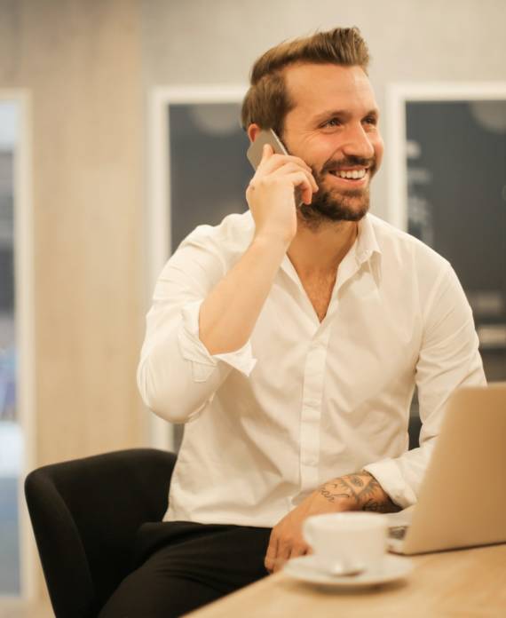man using smartphone on chair